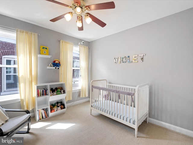 1503 W Tenth St, Wilmington, DE 19806 - bedroom featuring carpet floors, a crib, a ceiling fan, and baseboards