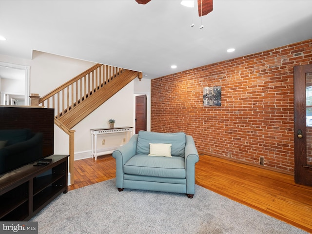 1503 W Tenth St, Wilmington, DE 19806 - living area with brick wall, wood finished floors, stairs, ceiling fan, and recessed lighting