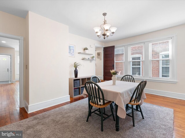1503 W Tenth St, Wilmington, DE 19806 - dining room with a chandelier, wood finished floors, and baseboards