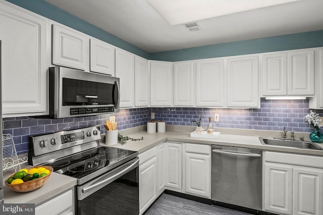 2021 Rudy Serra Dr Unit 1D, Eldersburg, MD 21784 - kitchen with appliances with stainless steel finishes, white cabinets, a sink, and light countertops