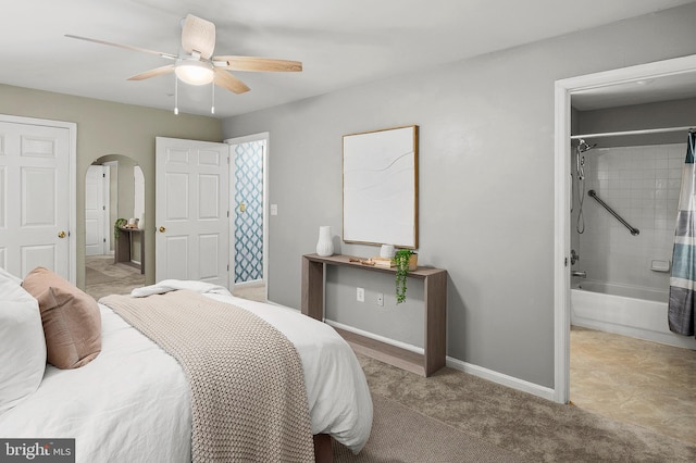 2021 Rudy Serra Dr Unit 1D, Eldersburg, MD 21784 - bedroom featuring arched walkways, baseboards, ceiling fan, and ensuite bathroom