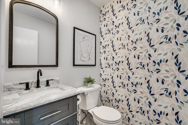 bathroom with vanity and toilet