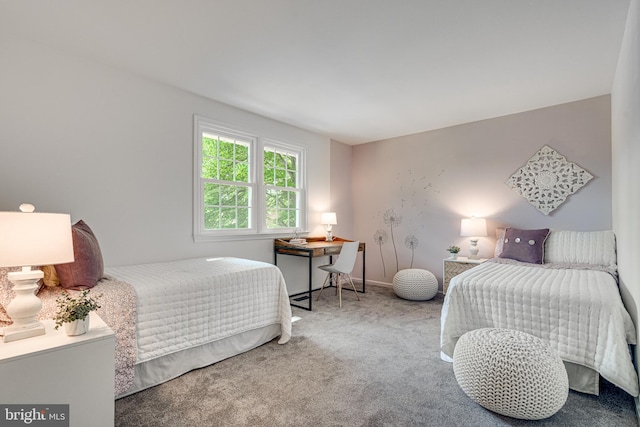 carpeted bedroom with baseboards