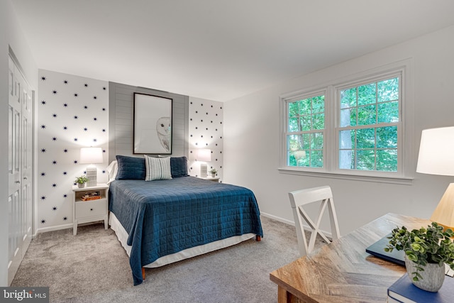 carpeted bedroom with baseboards