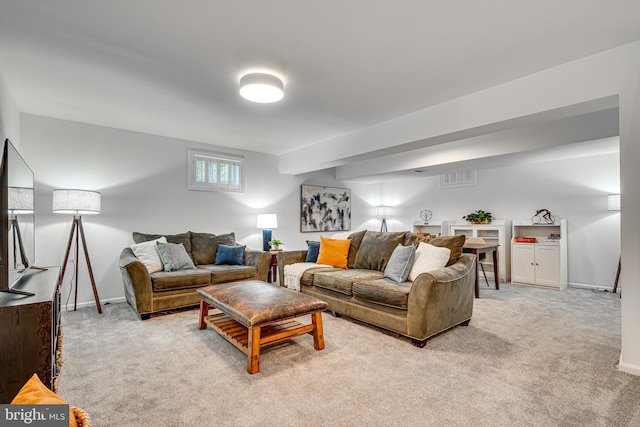 living room with light carpet and baseboards