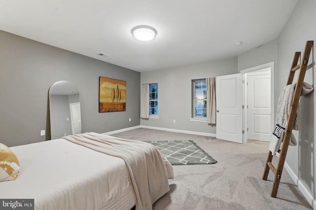 carpeted bedroom with baseboards
