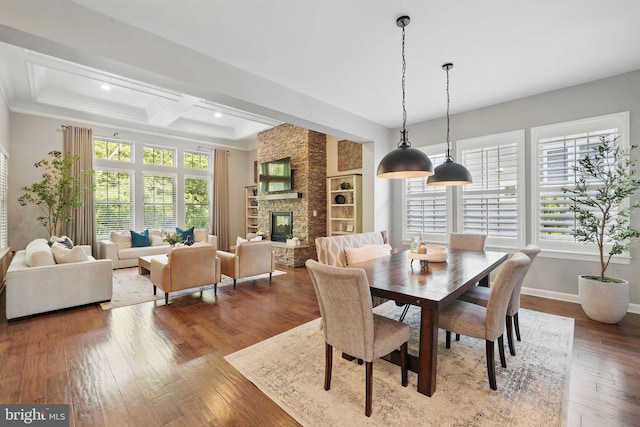dining room with dark wood-type flooring, coffered ceiling, beamed ceiling, ornamental molding, and recessed lighting