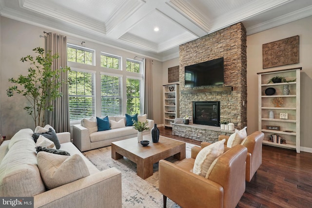 living room with hardwood / wood-style flooring, ornamental molding, beamed ceiling, a fireplace, and coffered ceiling