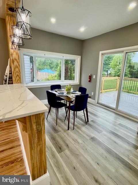 25 Elmont Ave, Baltimore, MD 21206 - dining room featuring a chandelier, light wood-style flooring, recessed lighting, and baseboards