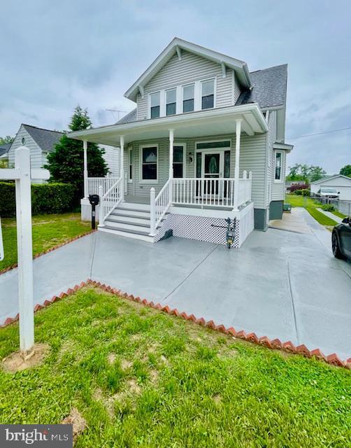 25 Elmont Ave, Baltimore, MD 21206 - bungalow featuring covered porch and a front lawn