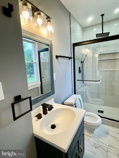 25 Elmont Ave, Baltimore, MD 21206 - full bathroom featuring vanity, a stall shower, toilet, and marble look tiles