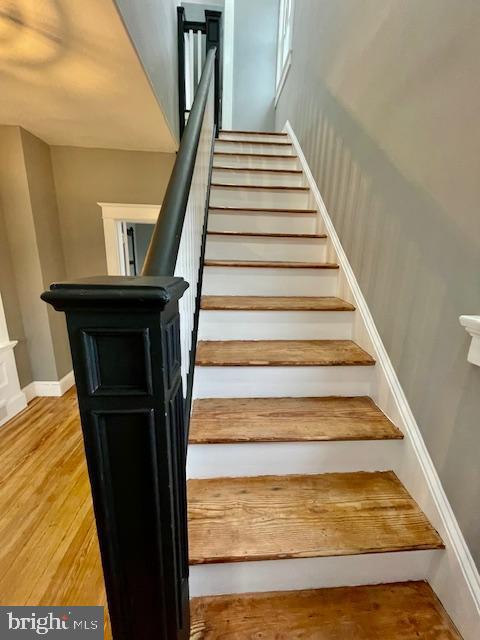25 Elmont Ave, Baltimore, MD 21206 - stairs featuring baseboards and wood finished floors