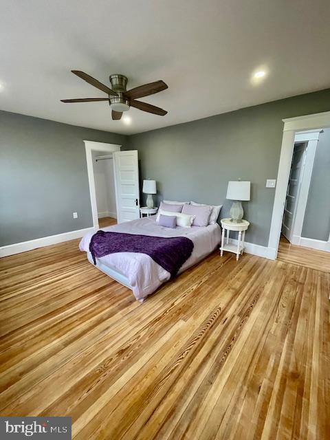 25 Elmont Ave, Baltimore, MD 21206 - bedroom with baseboards, wood finished floors, ceiling fan, a walk in closet, and recessed lighting