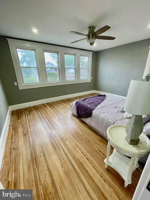 25 Elmont Ave, Baltimore, MD 21206 - bedroom with wood finished floors, baseboards, and ceiling fan