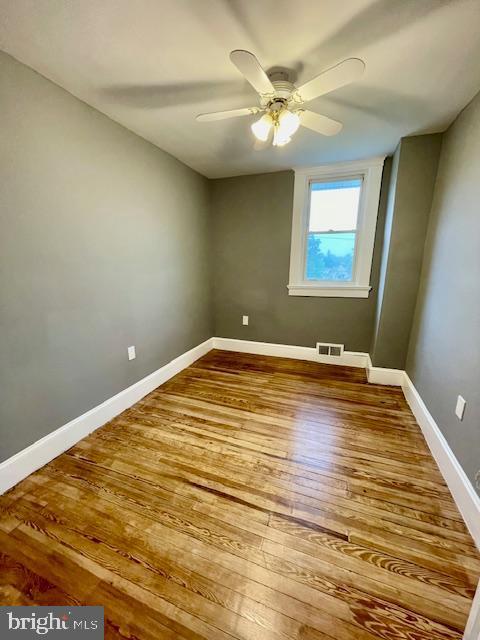 25 Elmont Ave, Baltimore, MD 21206 - spare room featuring a ceiling fan, baseboards, and wood finished floors