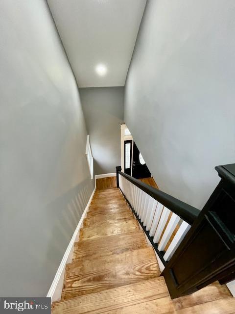 25 Elmont Ave, Baltimore, MD 21206 - stairs featuring hardwood / wood-style flooring and baseboards