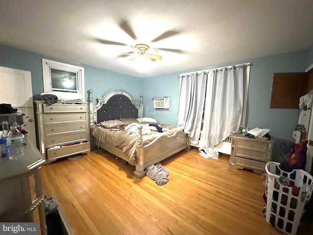 2257 Disston St, Philadelphia, PA 19149 - bedroom with wood finished floors, an AC wall unit, and ceiling fan