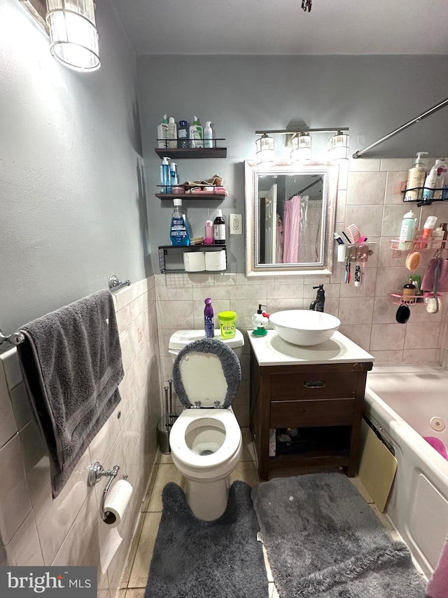 2257 Disston St, Philadelphia, PA 19149 - bathroom with tile walls, tile patterned floors, shower / bathtub combination with curtain, vanity, and toilet