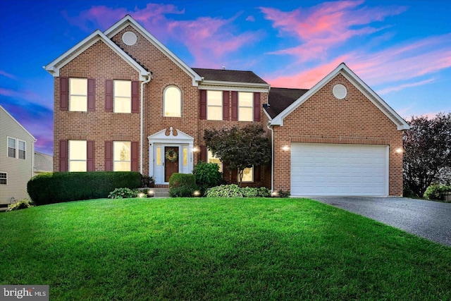 1109 Volos Ct, Bel Air, MD 21015 - view of front of home with driveway, brick siding, a front yard, and an attached garage