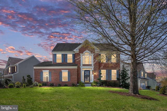 9278 Glen Meadow Ln, Bristow, VA 20136 - view of front of house featuring a yard and brick siding