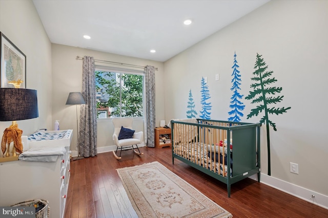1322 N Hollywood St, Philadelphia, PA 19121 - bedroom with hardwood / wood-style floors, baseboards, recessed lighting, and a nursery area