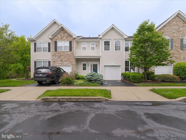 131 Stirrup Cir, West Chester, PA 19382 - view of property with driveway, stone siding, and an attached garage