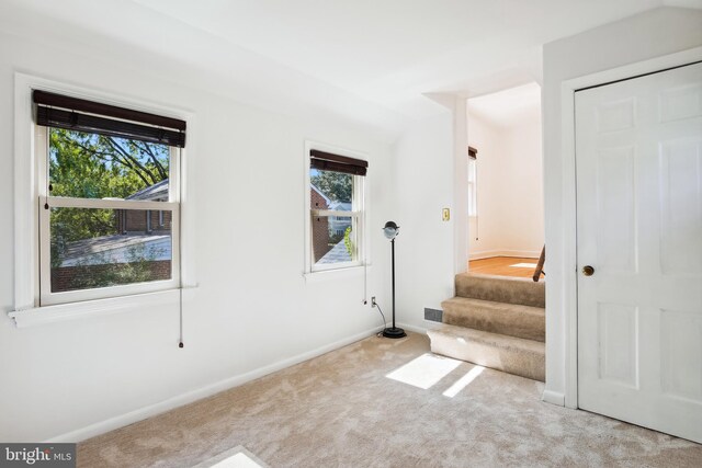 3122 1st St N, Arlington, VA 22201 - empty room with carpet floors, baseboards, healthy amount of natural light, and stairs