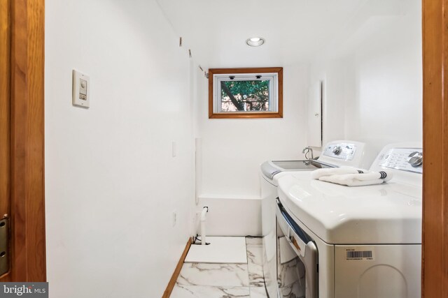 3122 1st St N, Arlington, VA 22201 - laundry room with separate washer and dryer and light marble finish flooring