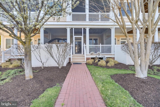 202 Muir St Unit 202, Cambridge, MD 21613 - view of front facade with a balcony and a sunroom
