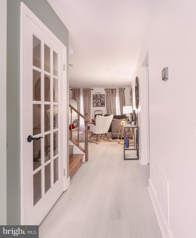15210 Emory Ct, Bowie, MD 20716 - hallway with stairs and wood finished floors