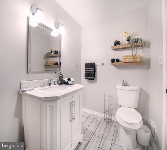 15210 Emory Ct, Bowie, MD 20716 - bathroom with vanity, baseboards, and toilet