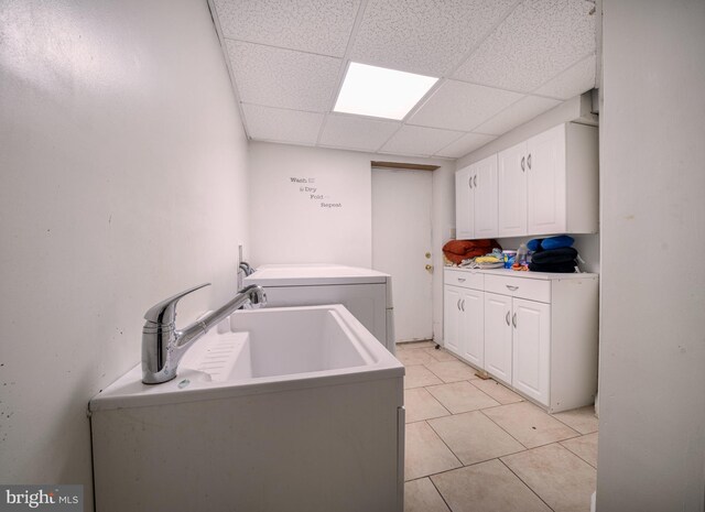 15210 Emory Ct, Bowie, MD 20716 - laundry room with cabinet space, washer and clothes dryer, and light tile patterned flooring