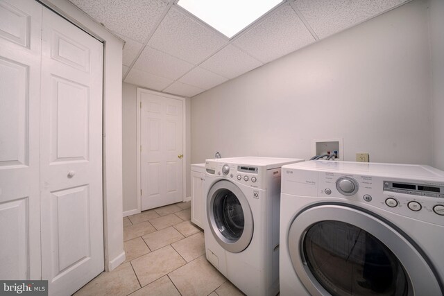 15210 Emory Ct, Bowie, MD 20716 - laundry room featuring washer and dryer, cabinet space, and light tile patterned floors