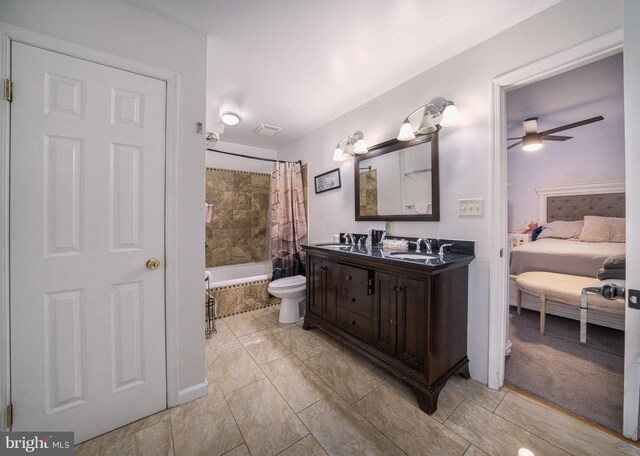 15210 Emory Ct, Bowie, MD 20716 - ensuite bathroom featuring tiled shower / bath combo, a ceiling fan, double vanity, and toilet