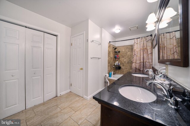 15210 Emory Ct, Bowie, MD 20716 - bathroom featuring a closet, curtained shower, double vanity, and baseboards