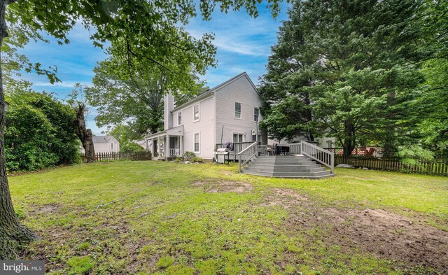 15210 Emory Ct, Bowie, MD 20716 - view of yard with a wooden deck