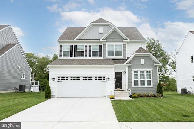 craftsman-style home featuring driveway, a garage, central air condition unit, and a front lawn