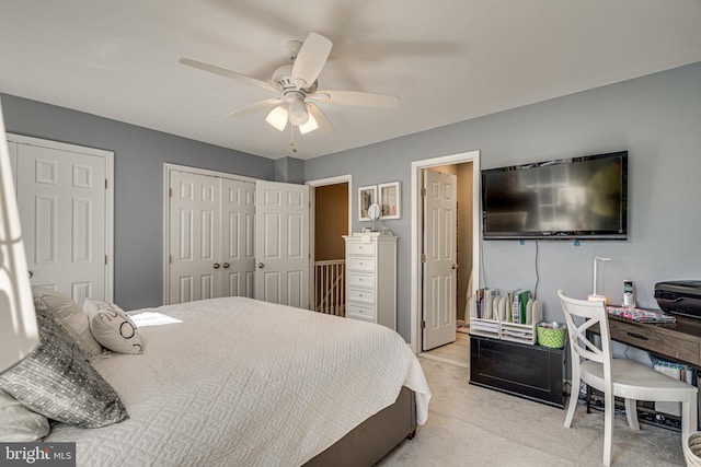 15656 Cliff Swallow Way, Rockville, MD 20853 - bedroom featuring light carpet, ceiling fan, and multiple closets