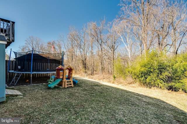 15656 Cliff Swallow Way, Rockville, MD 20853 - view of grassy yard featuring a trampoline