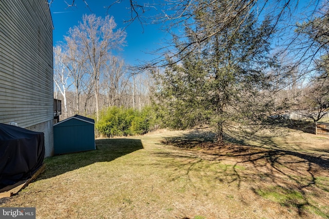 15656 Cliff Swallow Way, Rockville, MD 20853 - view of grassy yard featuring a storage unit