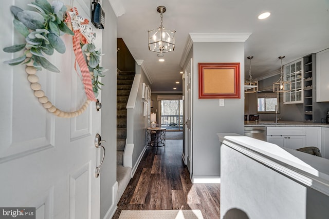 15656 Cliff Swallow Way, Rockville, MD 20853 - entrance foyer featuring crown molding, dark wood-style flooring, a chandelier, recessed lighting, and stairs