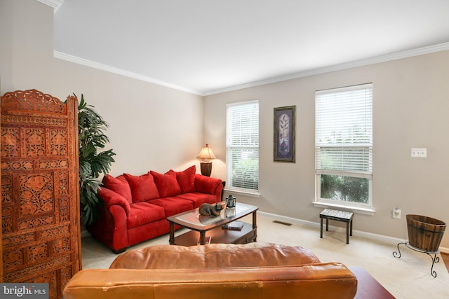 carpeted living room featuring crown molding and baseboards
