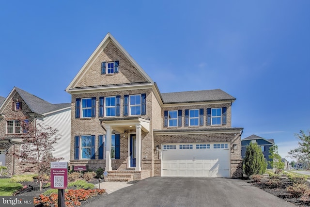 6501 Clubhouse Dr, Laurel, MD 20708 - view of front of property with brick siding, a garage, and asphalt driveway