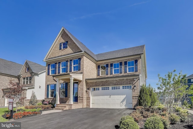 6501 Clubhouse Dr, Laurel, MD 20708 - view of front of property featuring brick siding, a garage, and asphalt driveway