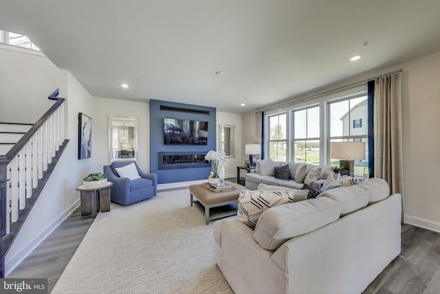 6501 Clubhouse Dr, Laurel, MD 20708 - living room featuring stairway, wood finished floors, baseboards, recessed lighting, and a large fireplace