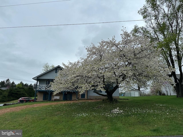 189 Columbia Dr, Kearneysville, WV 25430 - obstructed view of property with a front yard and a balcony