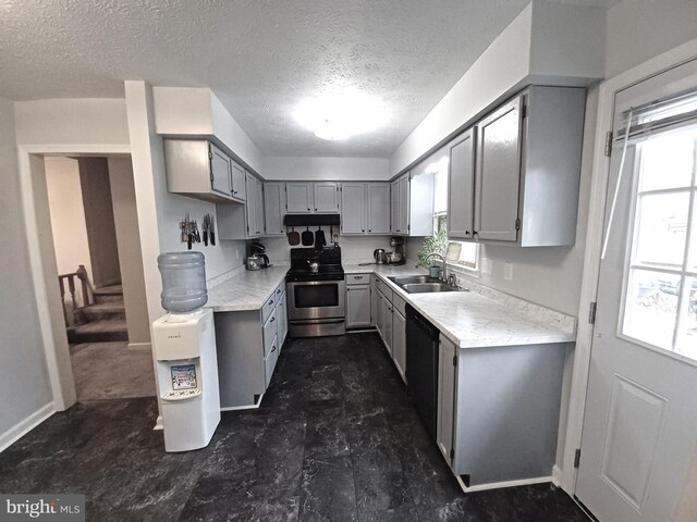 189 Columbia Dr, Kearneysville, WV 25430 - kitchen with stainless steel range with electric cooktop, gray cabinets, a sink, dishwasher, and a textured ceiling