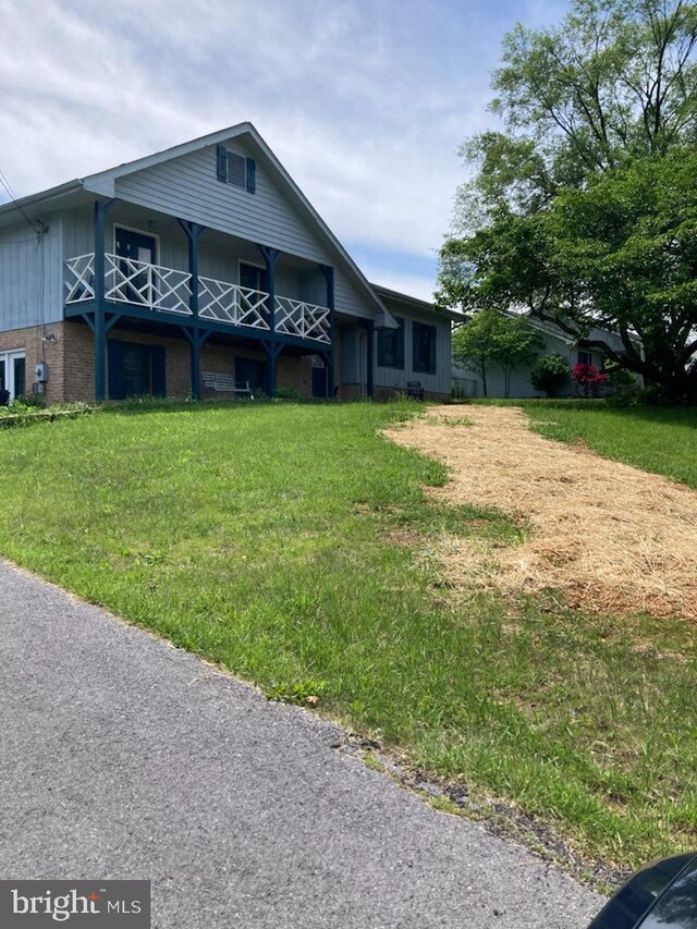 189 Columbia Dr, Kearneysville, WV 25430 - view of front of property with brick siding, a balcony, and board and batten siding
