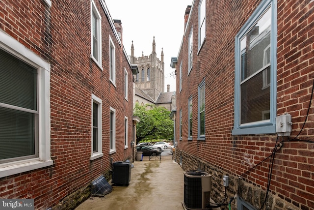 3632 Midvale Ave, Philadelphia, PA 19129 - view of side of property with central air condition unit, brick siding, and a patio