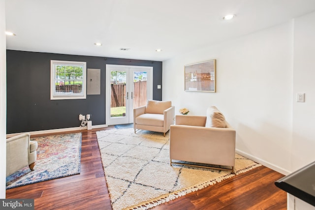 44007 Kitts Hill Ter, Ashburn, VA 20147 - living area with french doors, wood finished floors, recessed lighting, and electric panel